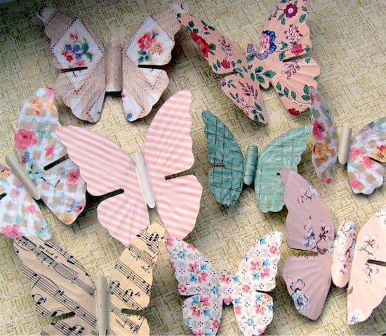 Turn antique metal butterflies into pretty magnets with wallpaper and Mod Podge. Use these easy butterfly decorations in your home decor!