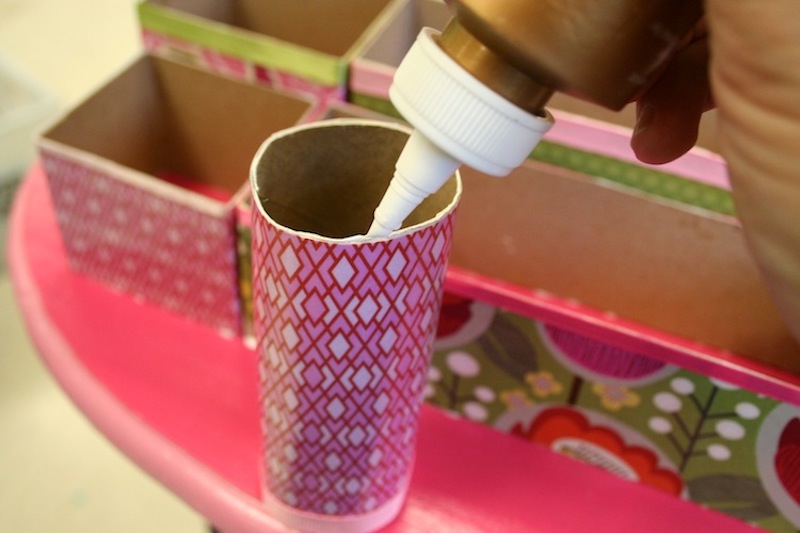 Add glue to the edges of the toilet paper rolls