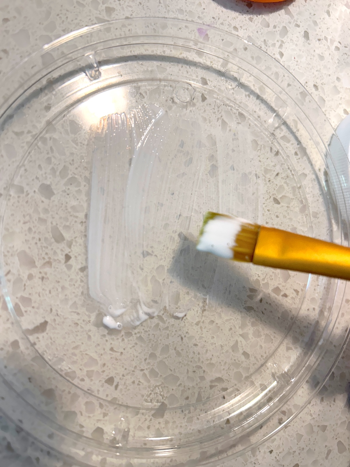 applying Mod Podge to the lid