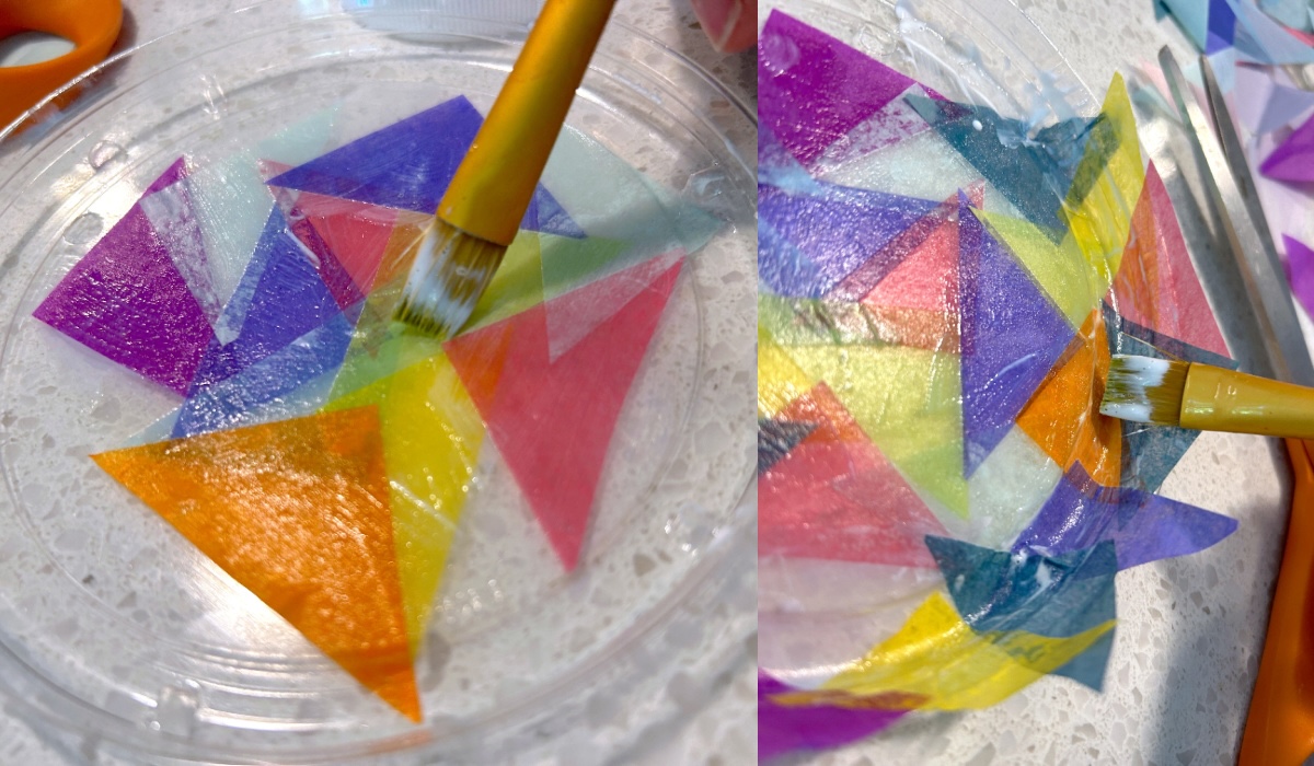 applying tissue paper to the plastic lid with Mod Podge