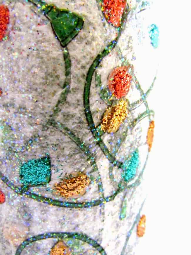 If you need a budget way to decorate your home for the holidays, these DIY candles are a great idea. Just add decoupage medium!
