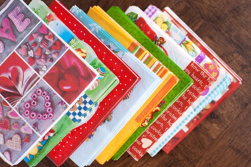 It's a lot easier to decoupage napkins to surfaces than you think! Learn how to do it with Mod Podge - tips, tricks, and a video included.