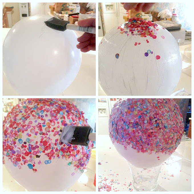 Applying Mod Podge to a balloon and then adding confetti
