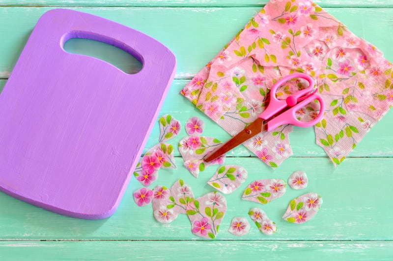 It's a lot easier to decoupage napkins to surfaces than you think! Learn how to do it with Mod Podge - tips, tricks, and a video included.