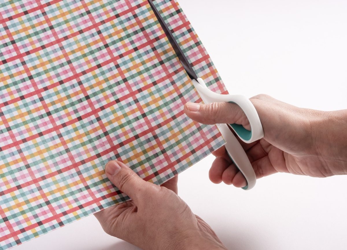 Cutting the paper out with scissors