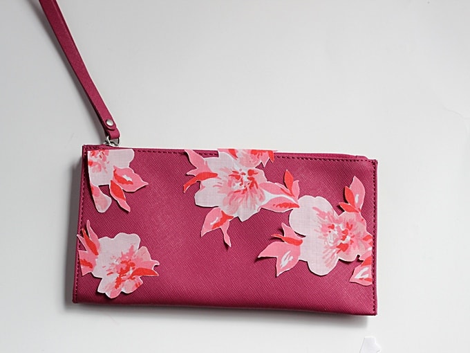 Clutch with unglued fabric flowers on the front