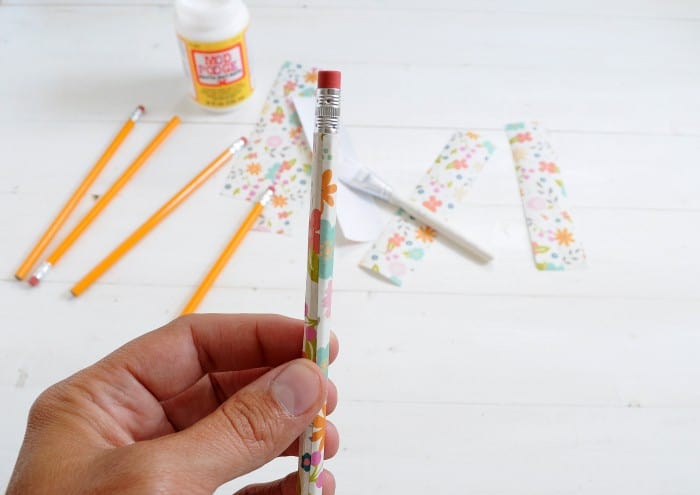 wrapping paper around the pencil