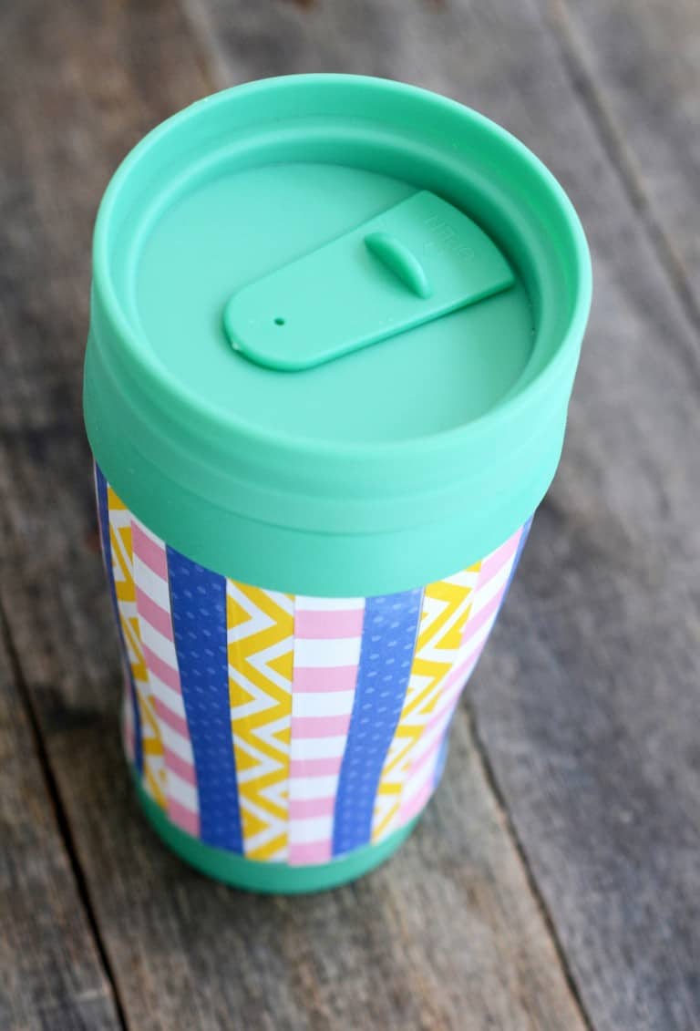 Decorate a travel mug with paper and Dishwasher Safe Mod Podge