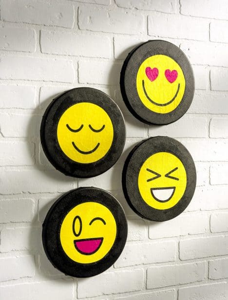 Are you wondering how to decoupage napkins on canvas? Learn how to do it with this emoji canvas project. Such a fun idea and very easy!