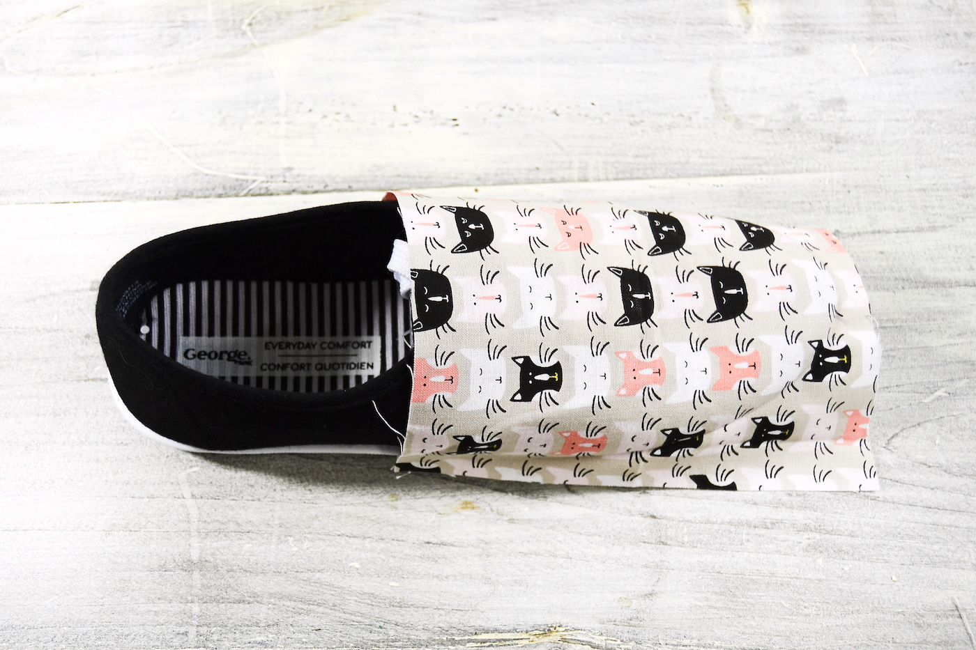 Fabric smoothed onto the top of a shoe