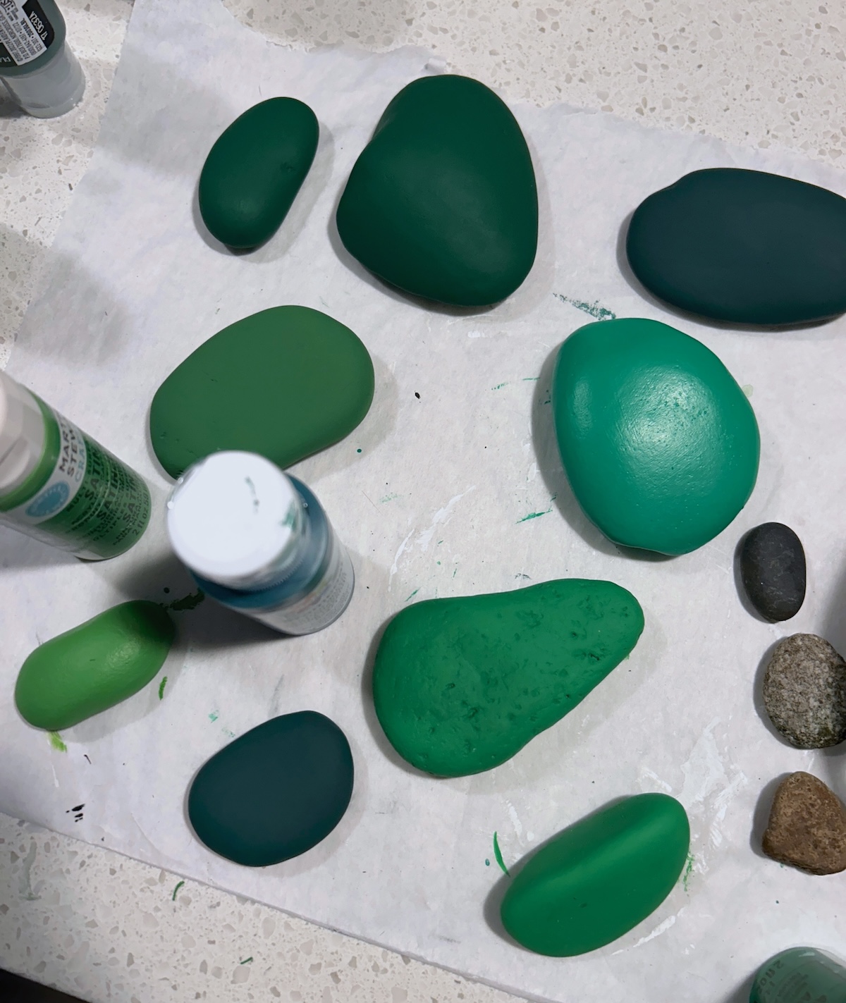 green painted rocks of various shades