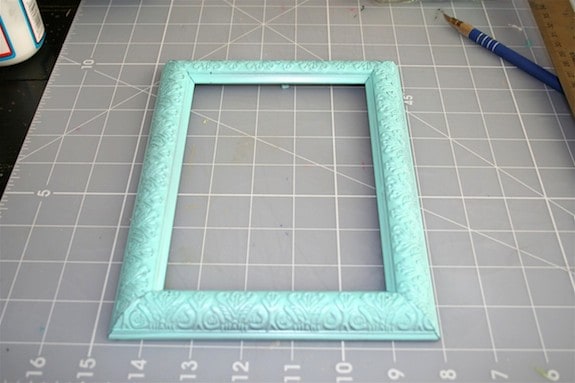 Dollar store frame that's been spray painted aqua