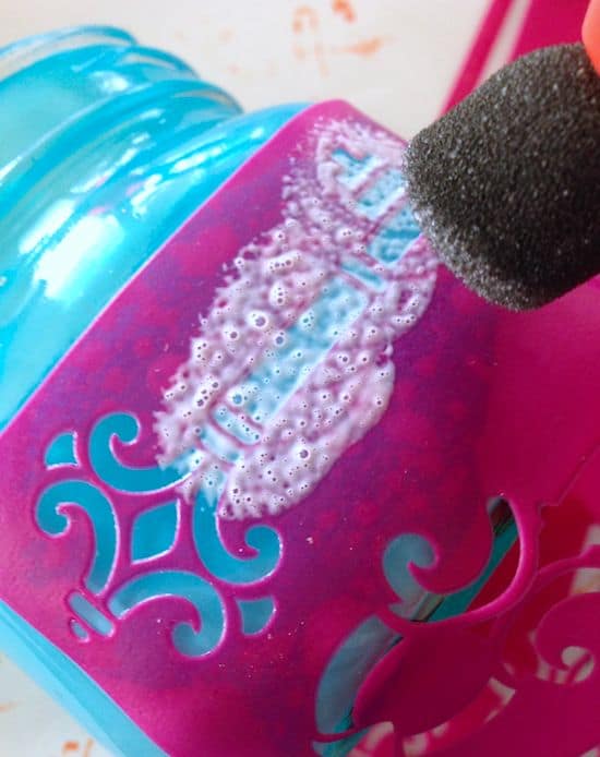 Add Mod Podge to the adhesive stencil with a spouncer