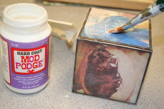 Adding Mod Podge Hard Coat to a wood block