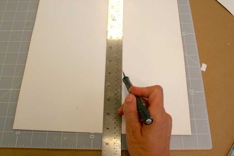 Measuring and cutting paper with an X-Acto knife