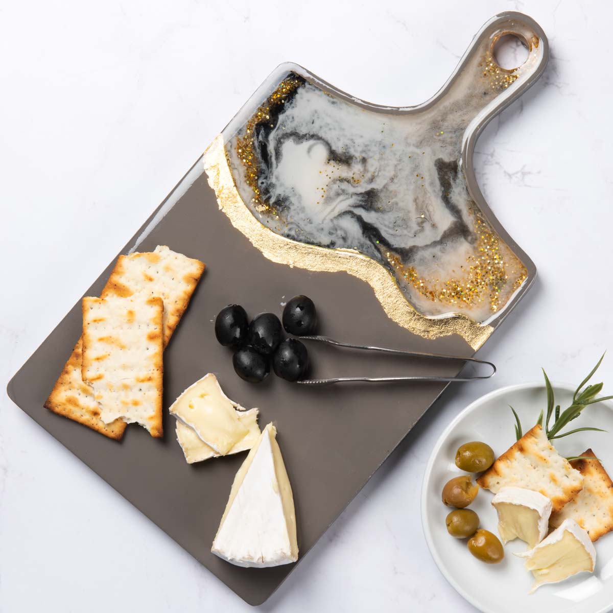 Metallic gold and black resin cutting board