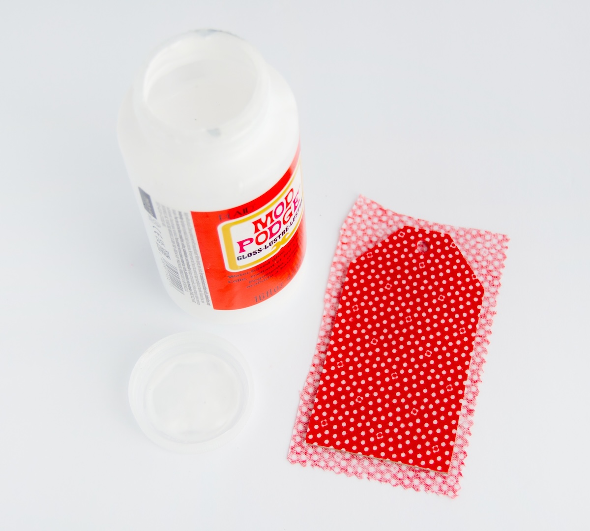 Mod Podge Fabric to Back of Tag