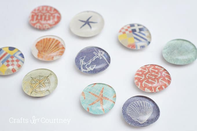 These DIY magnets are SO easy to make with decoupage medium and scrapbook paper! They have a fun nautical theme and make great gifts.