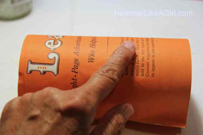 Hand smoothing paper onto the glass