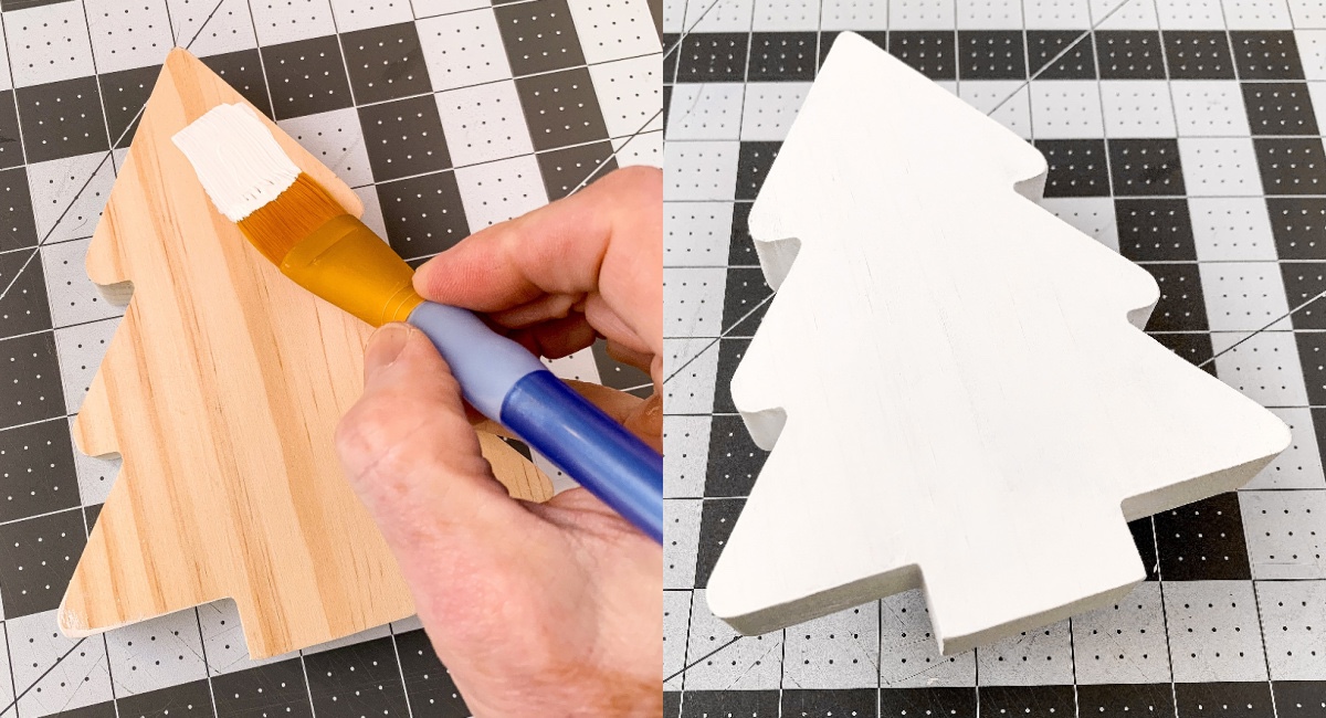painting both sides of a wood tree with white craft paint
