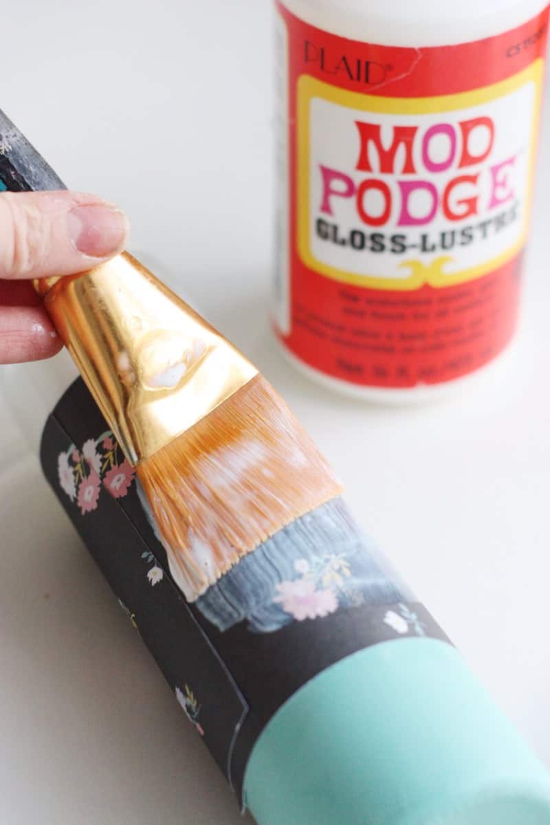 These paper-wrapped and paint-dipped candles use the power of Mod Podge to bring some springy life to some boring, dollar store candles.