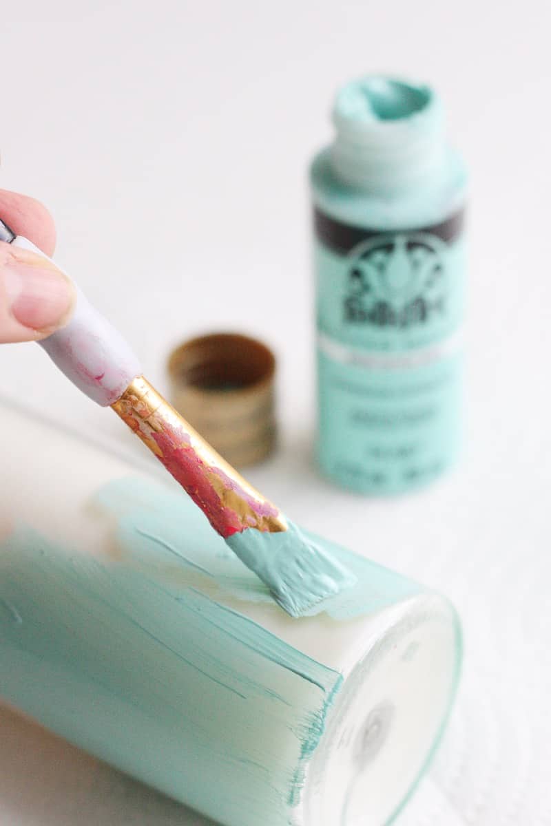 These paper-wrapped and paint-dipped candles use the power of Mod Podge to bring some springy life to some boring, dollar store candles.