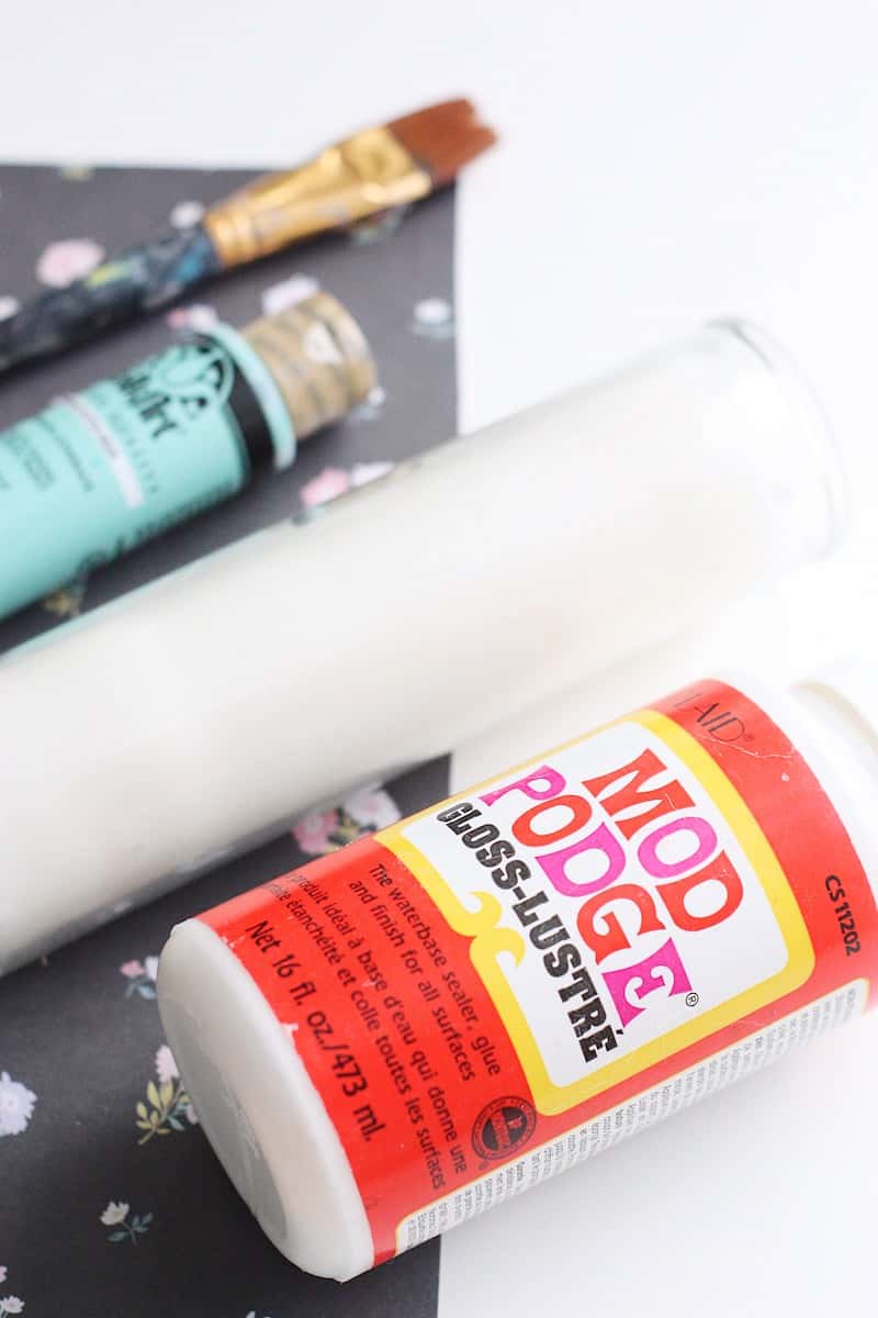 These paper-wrapped and paint-dipped candles use the power of Mod Podge to bring some springy life to some boring, dollar store candles.