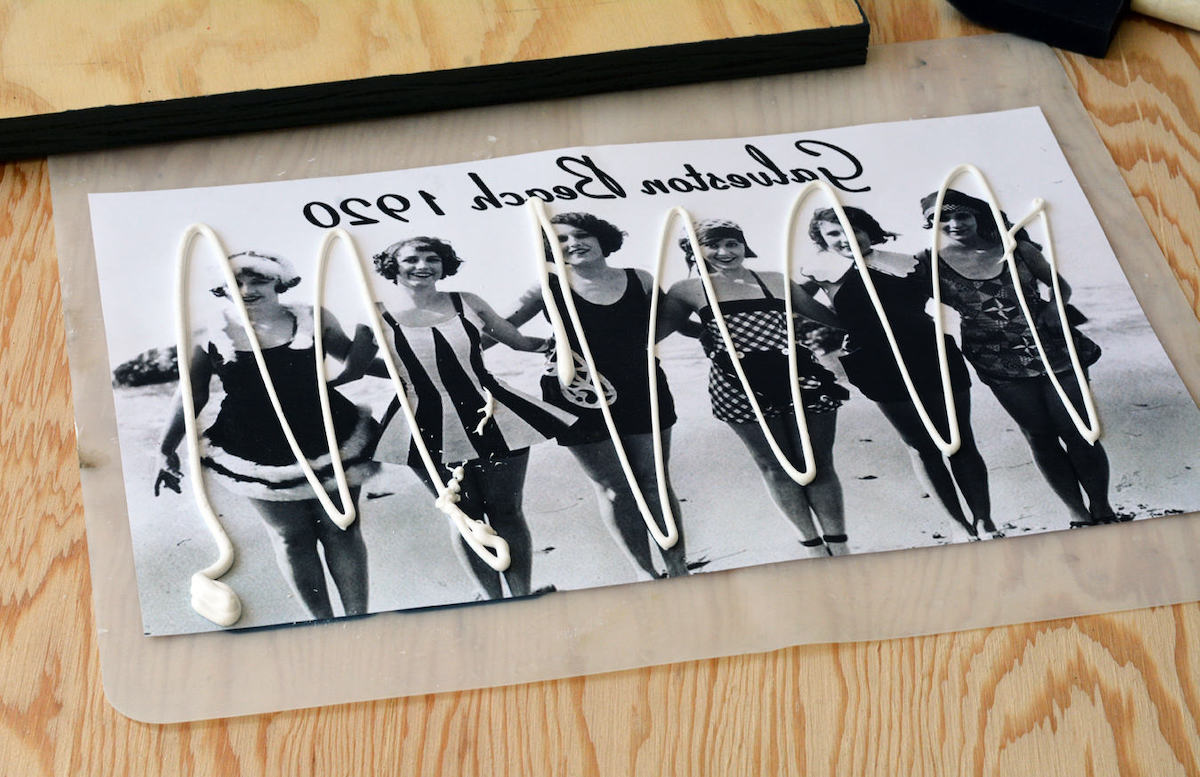Photo transfer medium applied to the top of a photo