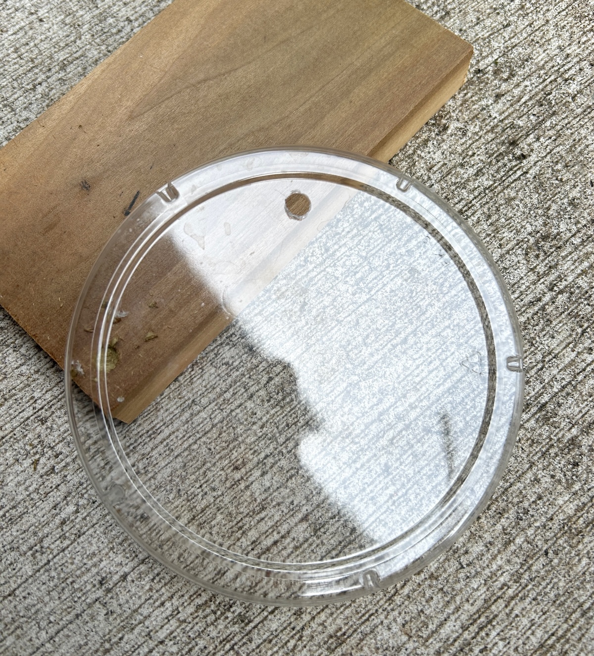 plastic lid with a hole in it