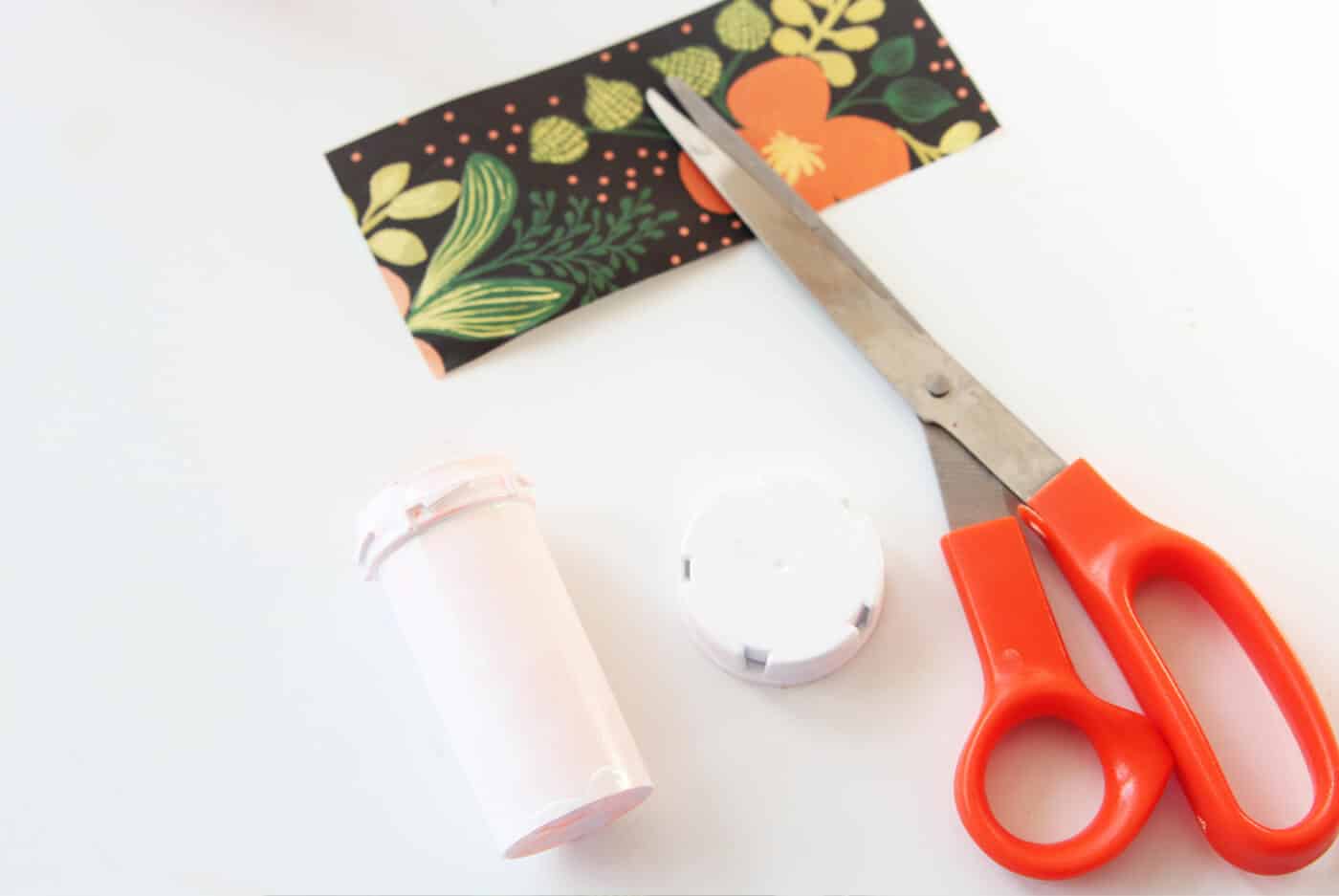 Paper cut to fit the pill bottles