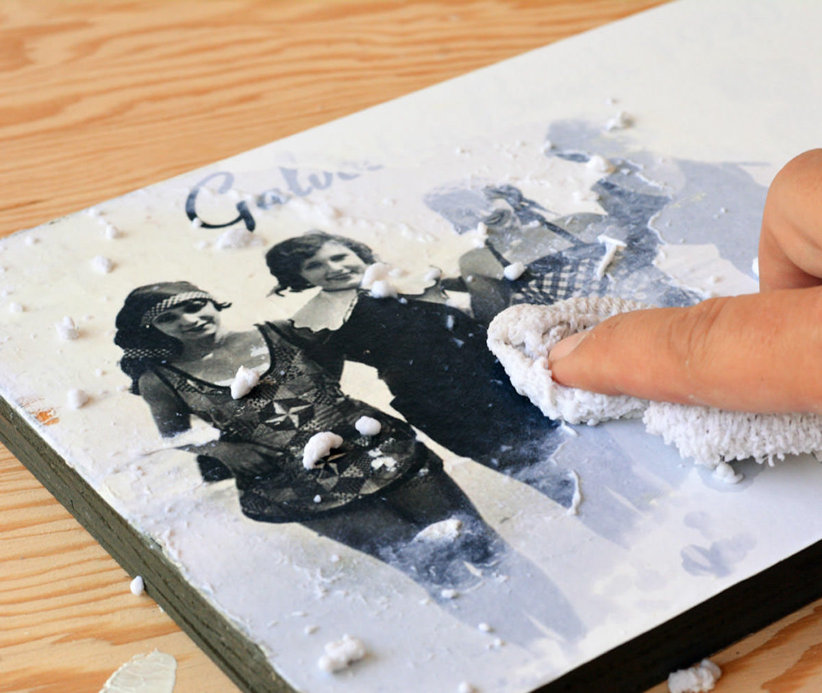 Rubbing the paper off with a damp cloth