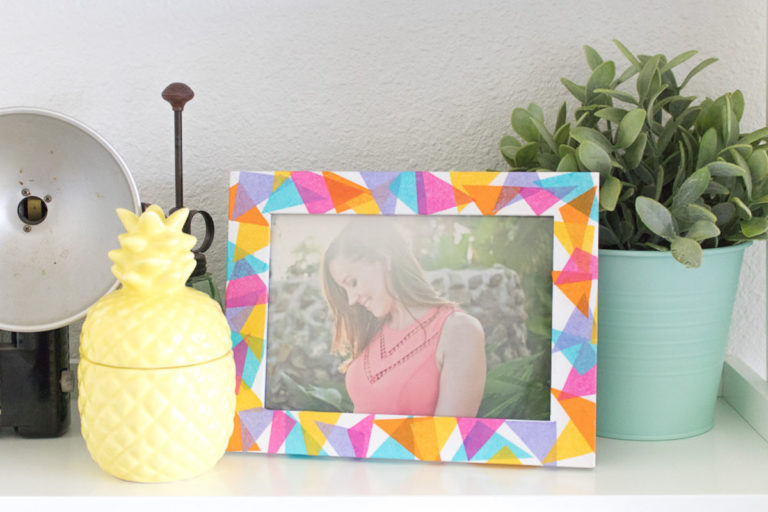 tissue paper and mod podge on a frame
