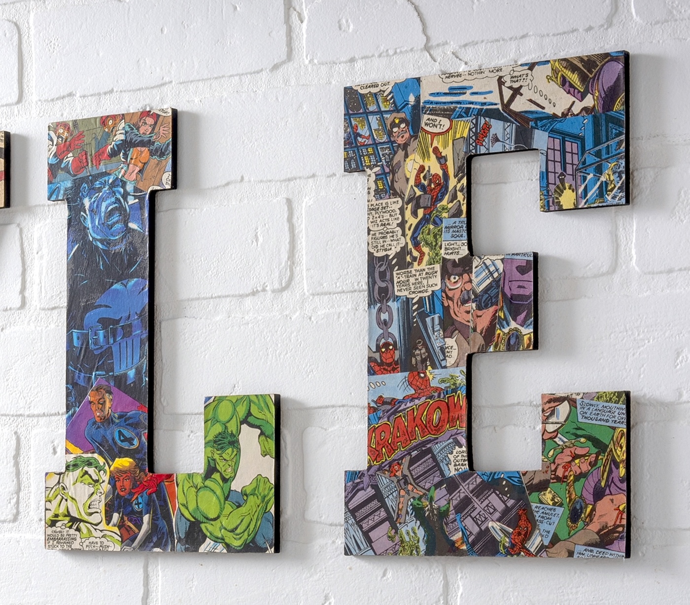 Wood letters covered with comic books